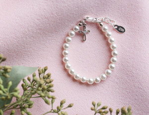 Lacey - White Pearl Bracelet with Infinity Cross Charm